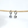 base_sdcsdedicion Pendientes aro con charm mundo acero inoxidable